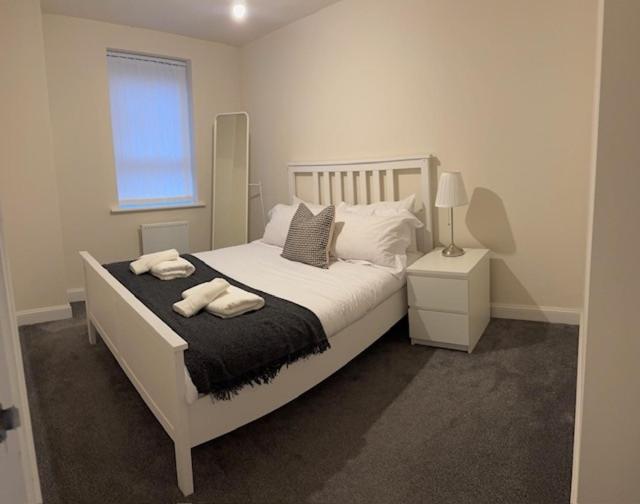 a bedroom with a bed with two towels on it at Home 4 Home short stay in Warren