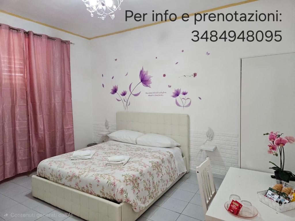 Ένα ή περισσότερα κρεβάτια σε δωμάτιο στο Le tre orchidee