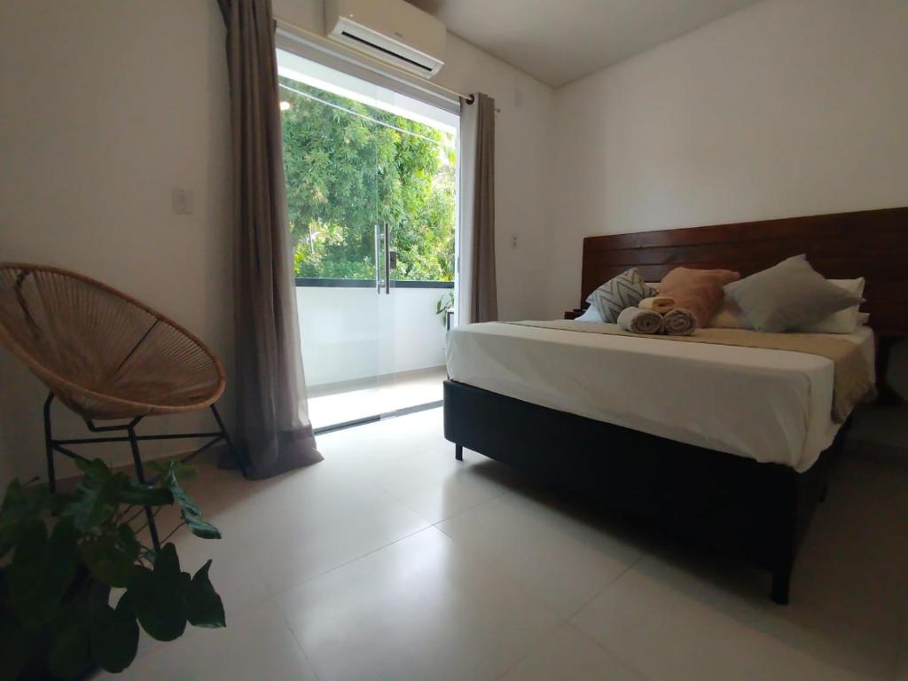 Ένα ή περισσότερα κρεβάτια σε δωμάτιο στο Apto Equipado Próximo às Praias de Itacaré Sunset1e3