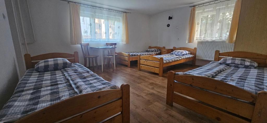 Postel nebo postele na pokoji v ubytování Noclegi Beskidzkie