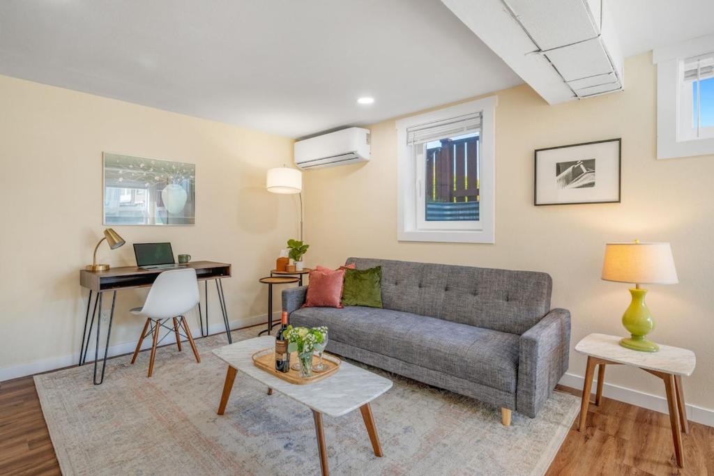 a living room with a couch and a table at Near Downtown & Waterfront, AC, Pet Friendly in Tacoma