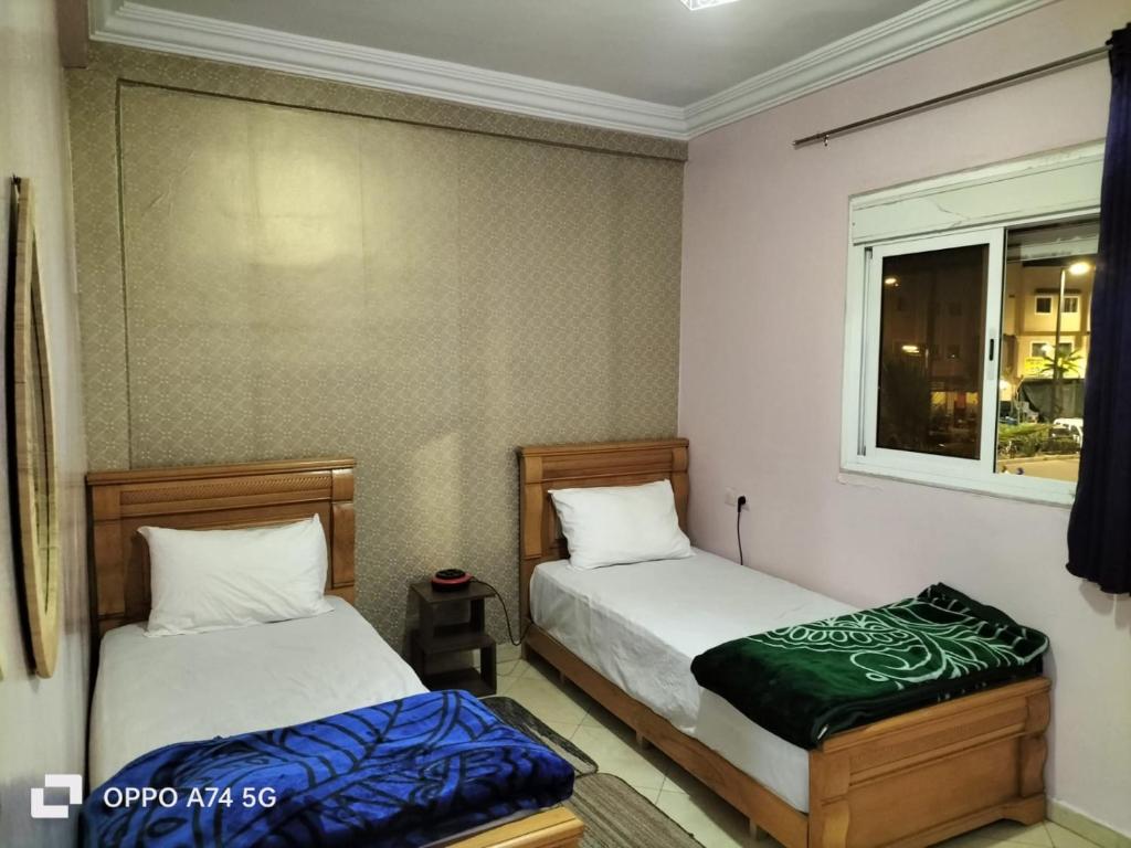 Ένα ή περισσότερα κρεβάτια σε δωμάτιο στο HOTEL 7DAYS DAkHLA