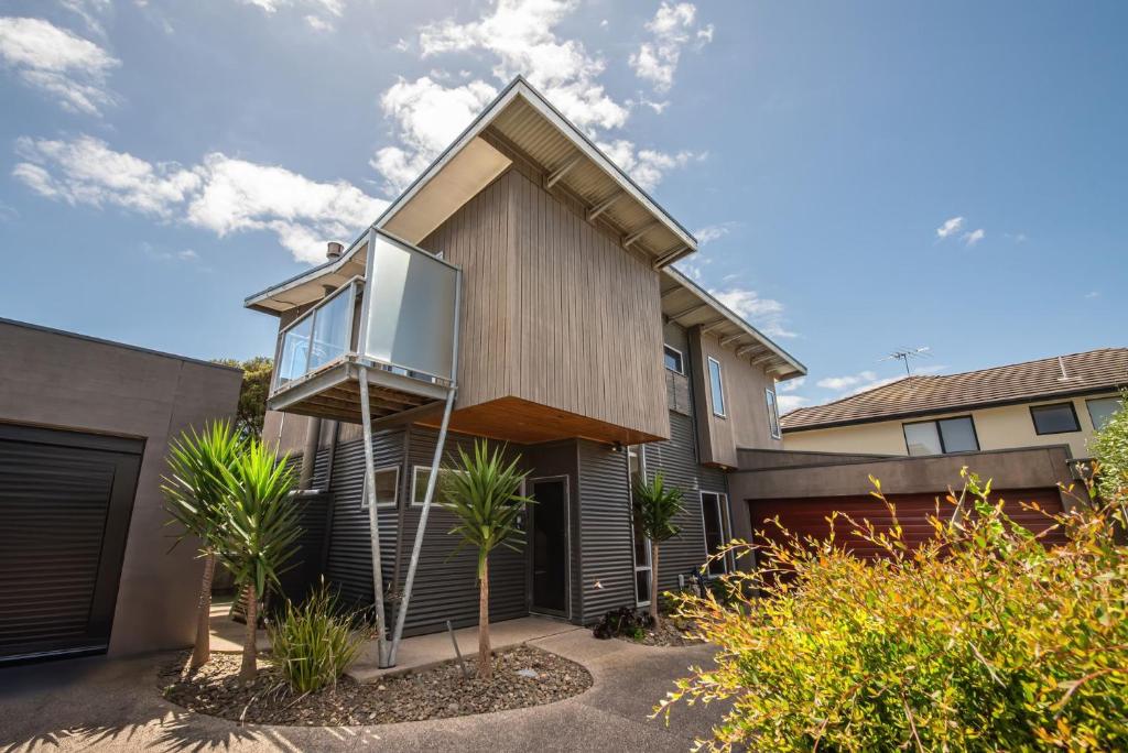 a house with a large window on the side of it at Summer Lane by Property Mums in Rye