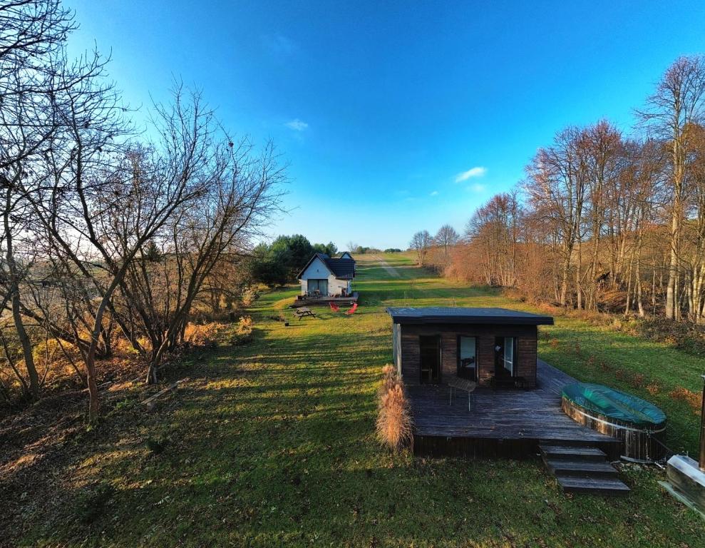 an aerial view of a small house in a field at Domki na polance in Horyniec Zdrój