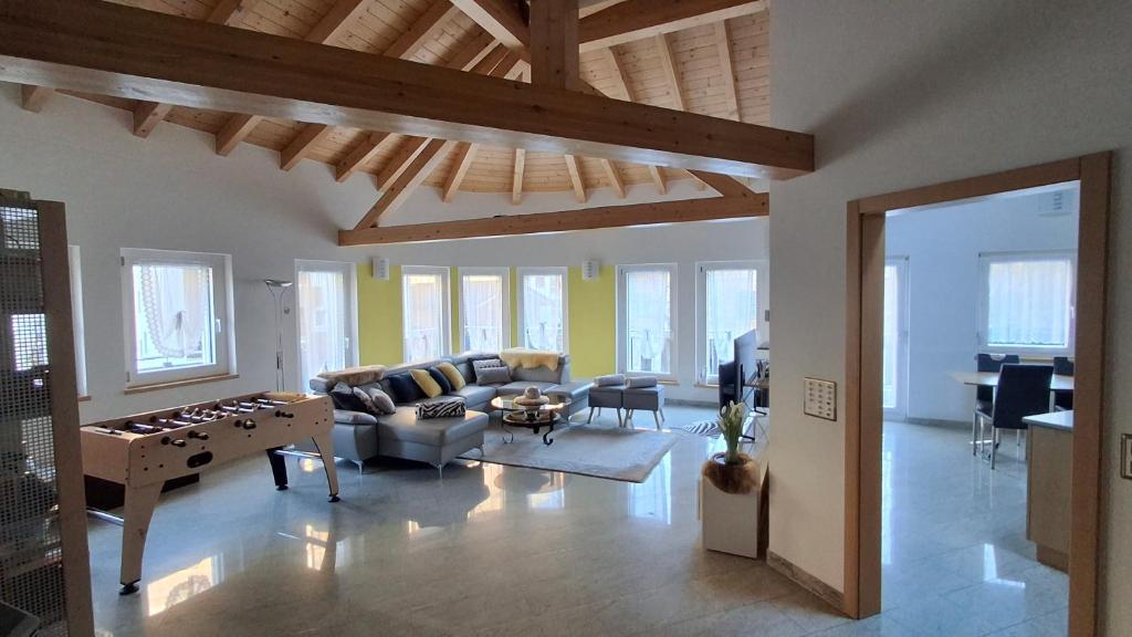 a living room with a couch and a table at Aquarell Apartments in Saas-Grund