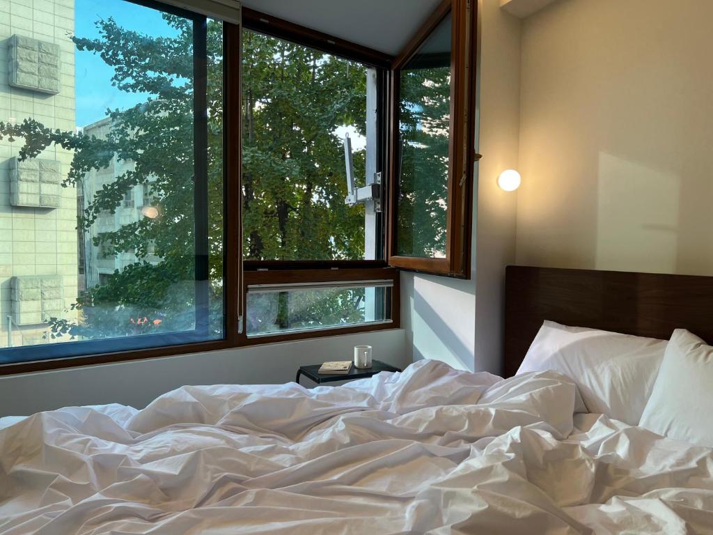 Ένα ή περισσότερα κρεβάτια σε δωμάτιο στο 이랑스테이 ILANG Stay