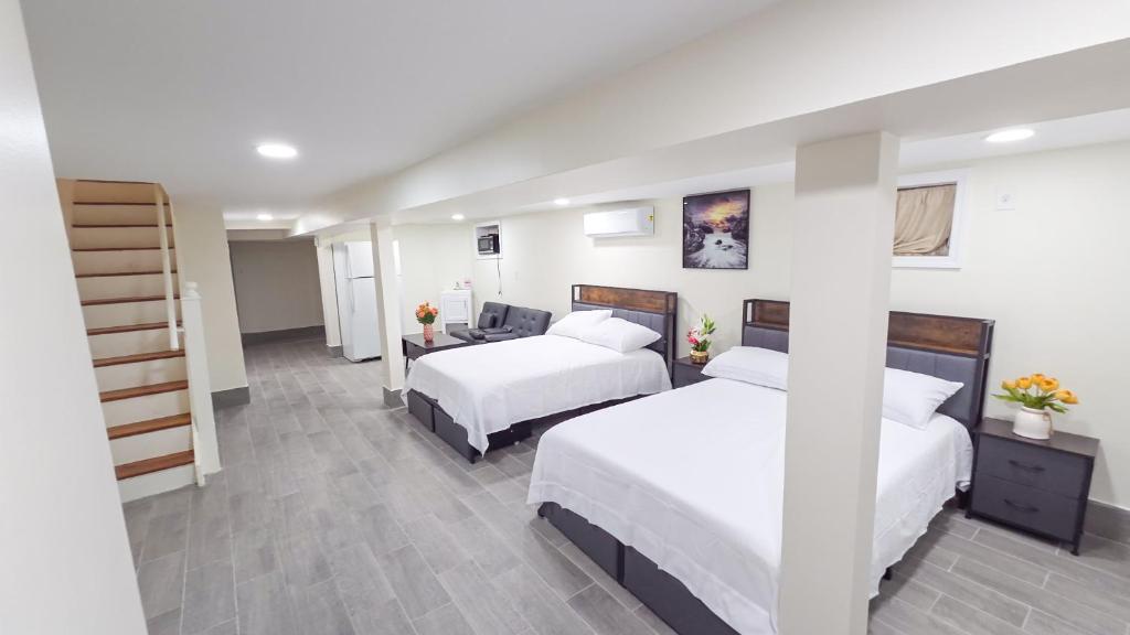 a hotel room with two beds and a desk at Amazing private single family house in Glendale