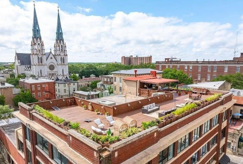 an aerial view of a city with a church at Sky Suite at 300 Drayton in Savannah