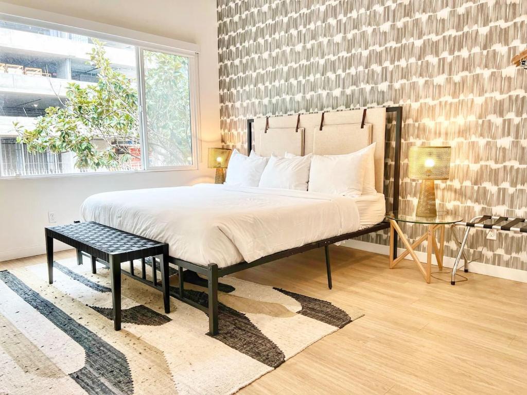 a bedroom with a large bed and a large window at Cozy Retreat In The Heart Of San Diego! in San Diego