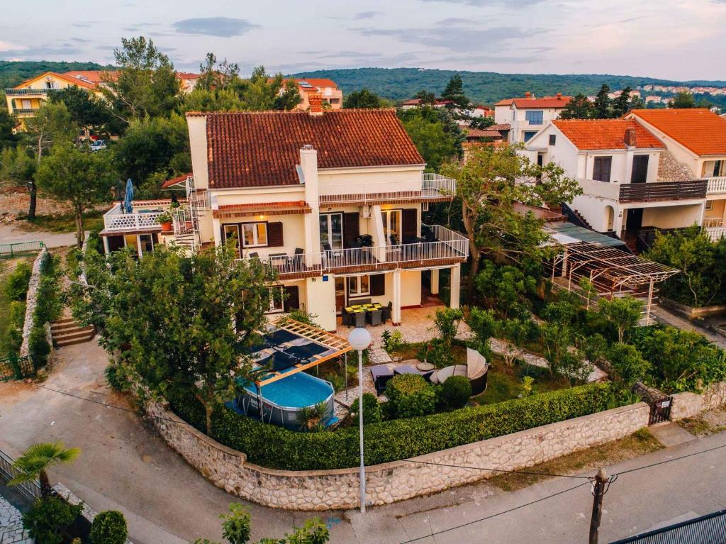 an aerial view of a house with a swimming pool at Apartments in Klimno - Insel Krk 42235 in Klimno
