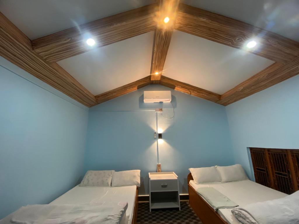 Postel nebo postele na pokoji v ubytování Hotel Dobhan