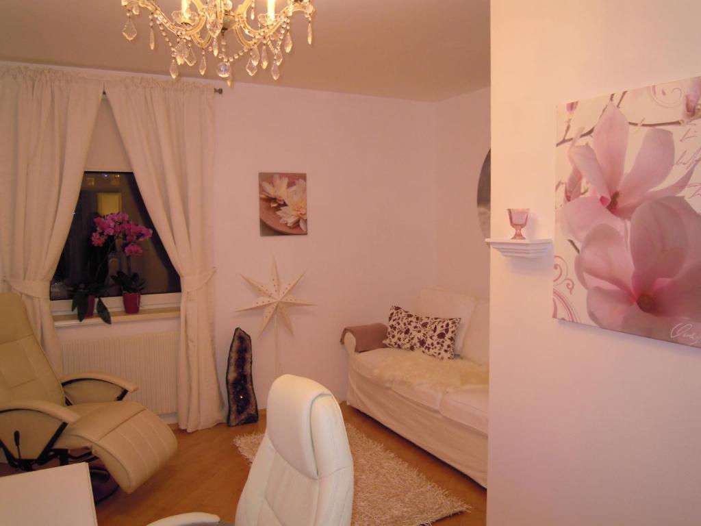 Postel nebo postele na pokoji v ubytování Orchidee