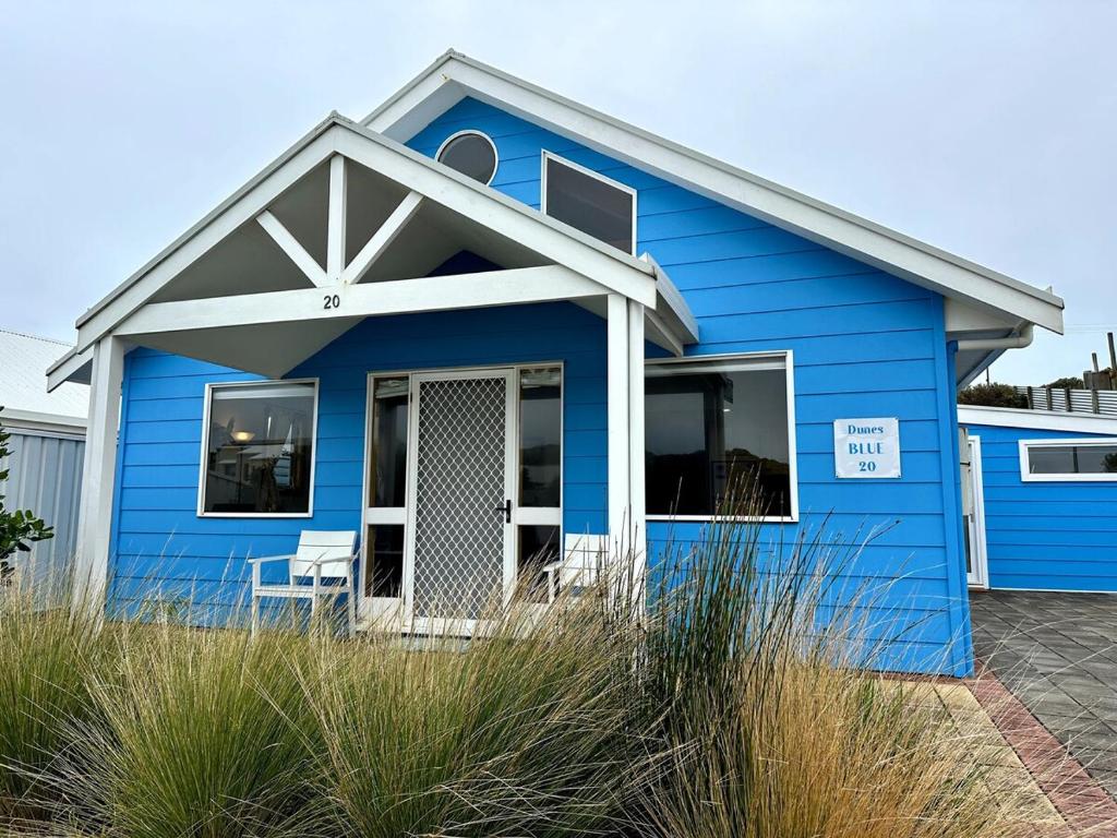 a blue house with a white roof at Dunes Blue at Robe in Robe