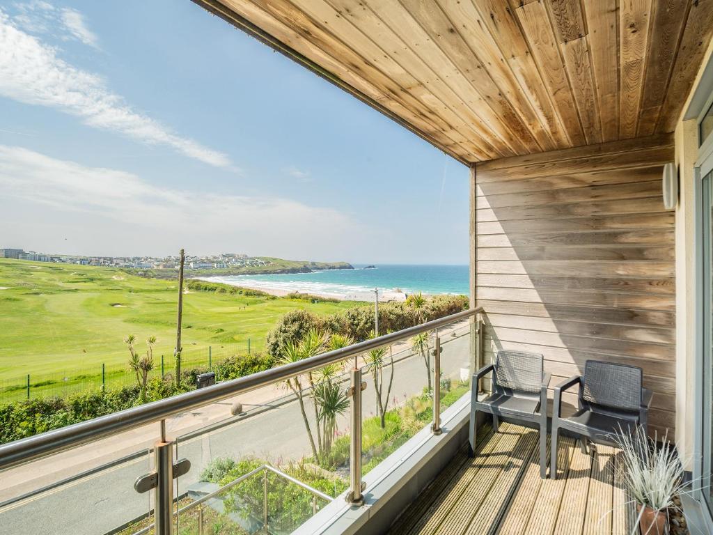 a balcony with a view of the ocean at 7 Cribbar in Newquay