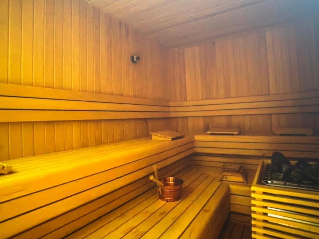 an empty sauna with a bucket in it at Cyprus Sunbay Retreat in Ayia Napa