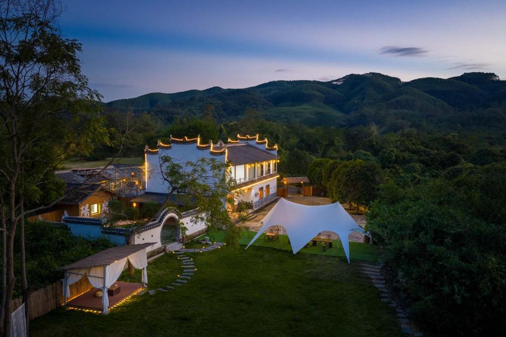 an aerial view of a house with a tent at Moonlit Cloud Inn Yangshuo Yulong River in Yangshuo