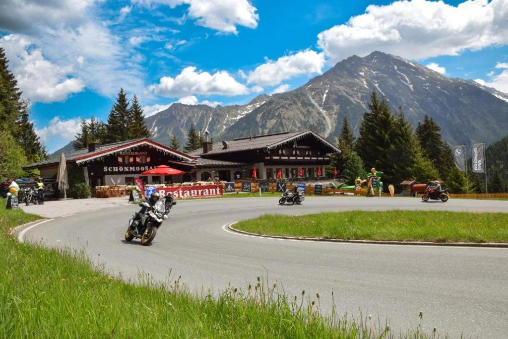 a group of people riding motorcycles on a road at Schönmoosalm - Four-Bedroom Standard Apartment in Krimml