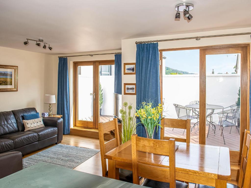 a living room with a couch and a table at The Old Laundry 3 in Keswick