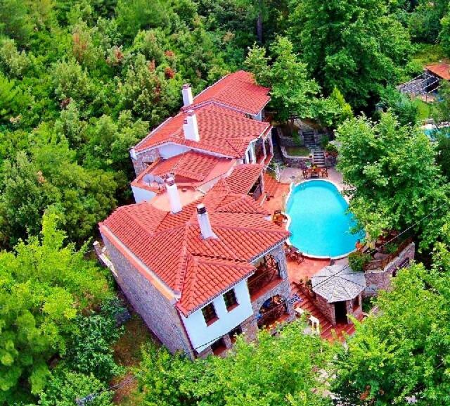 an overhead view of a house with a swimming pool at Magkafinis.el Apartments in Mikrós Prínos