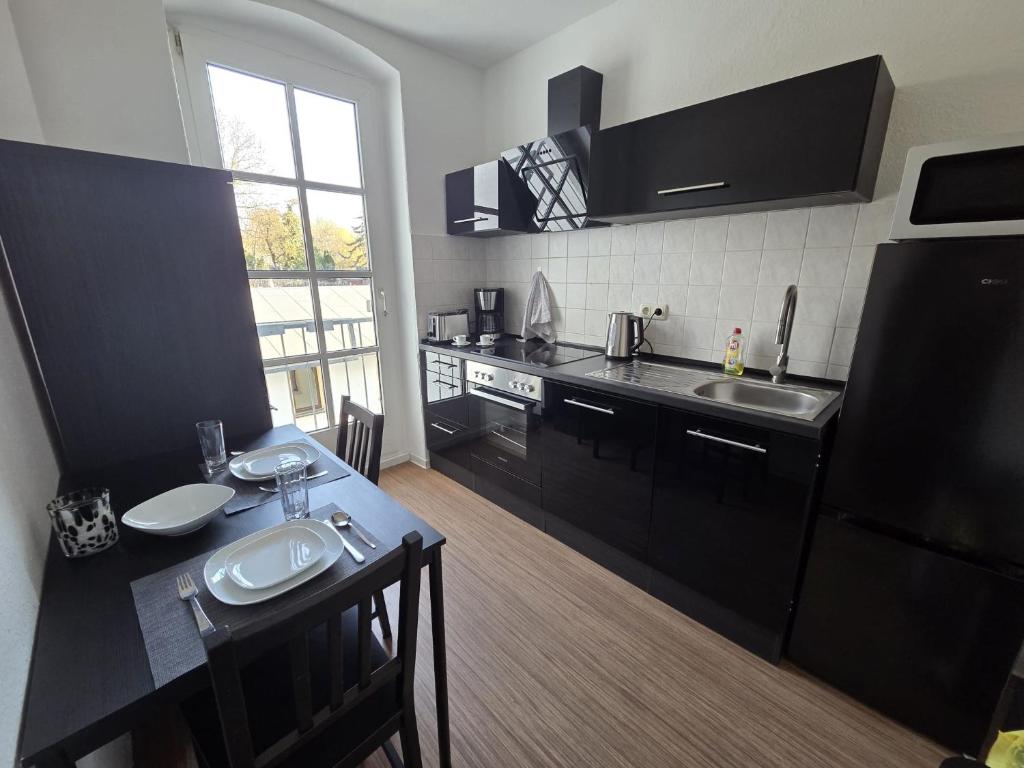 Kuchyň nebo kuchyňský kout v ubytování Stylische Flat mit franzsischem Balkon