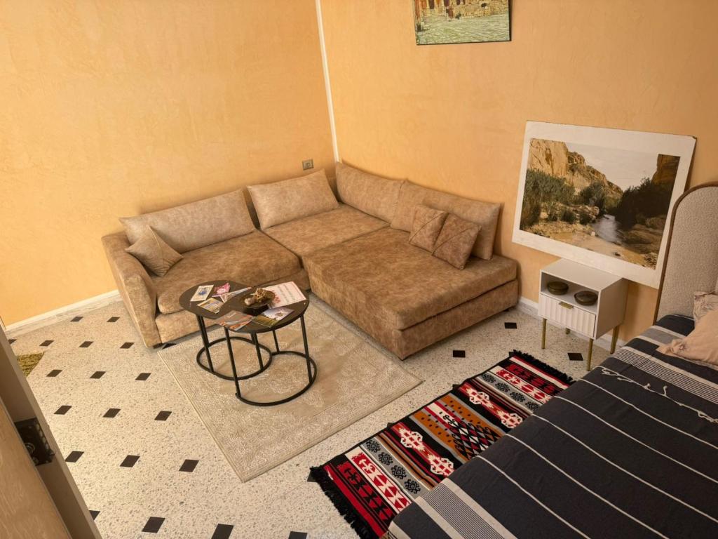 Posezení v ubytování Appart près des ruines romaines.