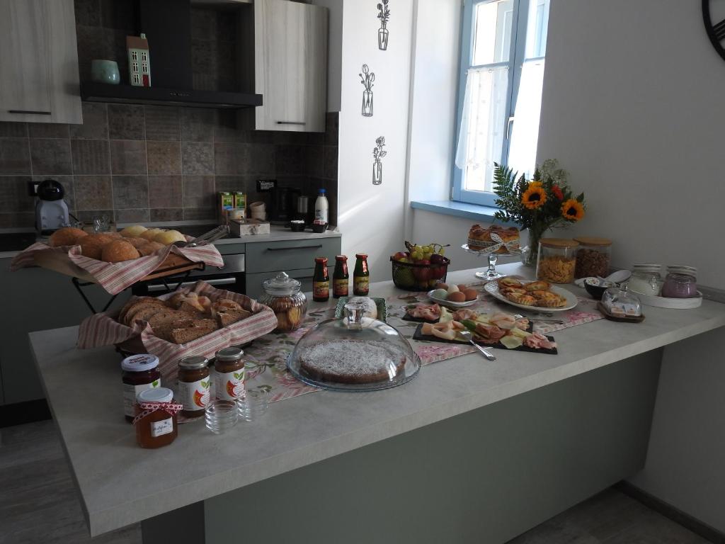 a kitchen counter with a bunch of food on it at B&B Stella d'Oro in Vezzano