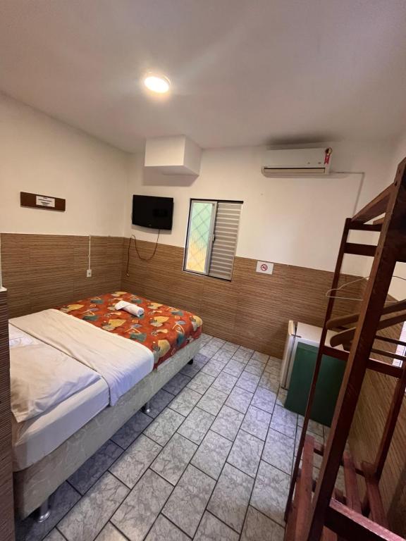 Ένα ή περισσότερα κρεβάτια σε δωμάτιο στο BC Paradise Hostel & Suítes