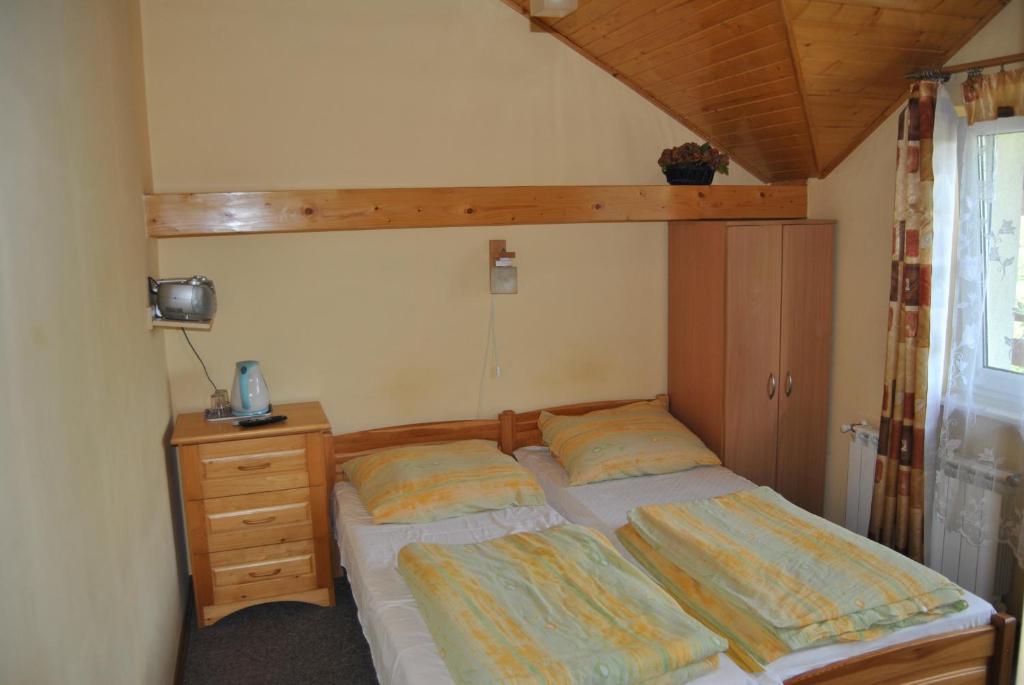 Postel nebo postele na pokoji v ubytování Willa pod Pilskiem