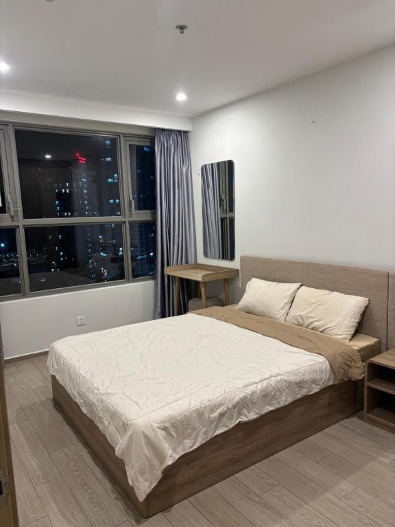 Ένα ή περισσότερα κρεβάτια σε δωμάτιο στο The Sóng Vũng Tàu Ocean Pearl Homestay