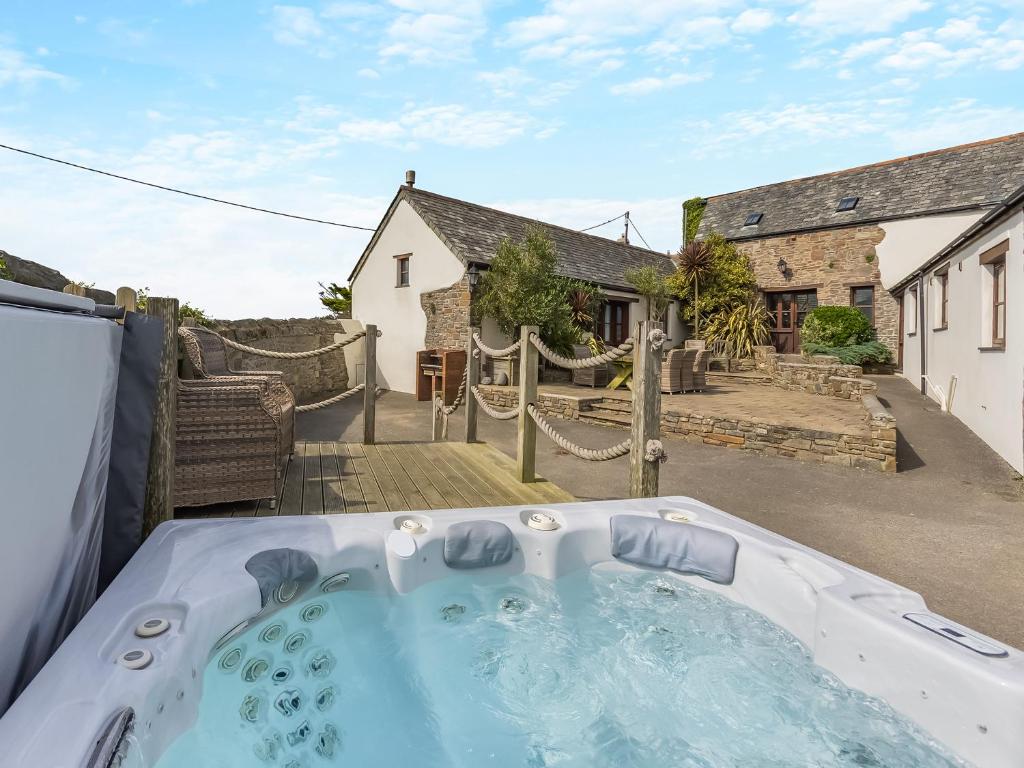 a hot tub in the backyard of a house at Atlantic House in Bideford