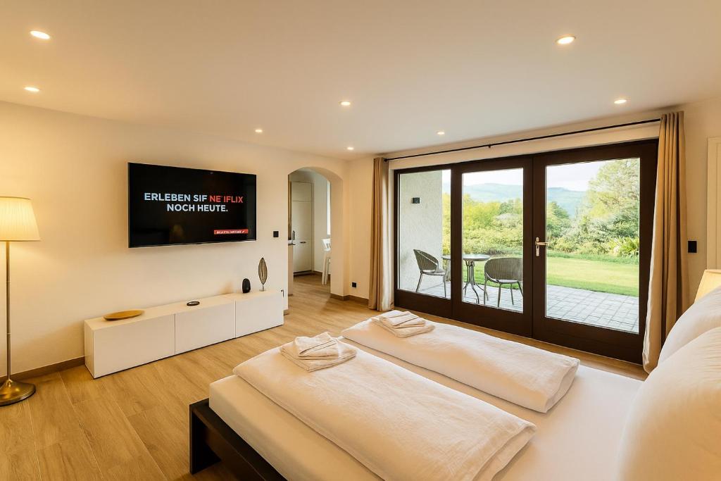 Ένα ή περισσότερα κρεβάτια σε δωμάτιο στο Alpenpanorama Renoviertes Apartment mit Bergblick