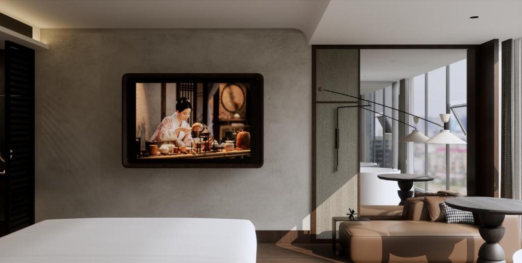 Ένα ή περισσότερα κρεβάτια σε δωμάτιο στο The Panda Artisan, Taikoo Li Xilia Hotel