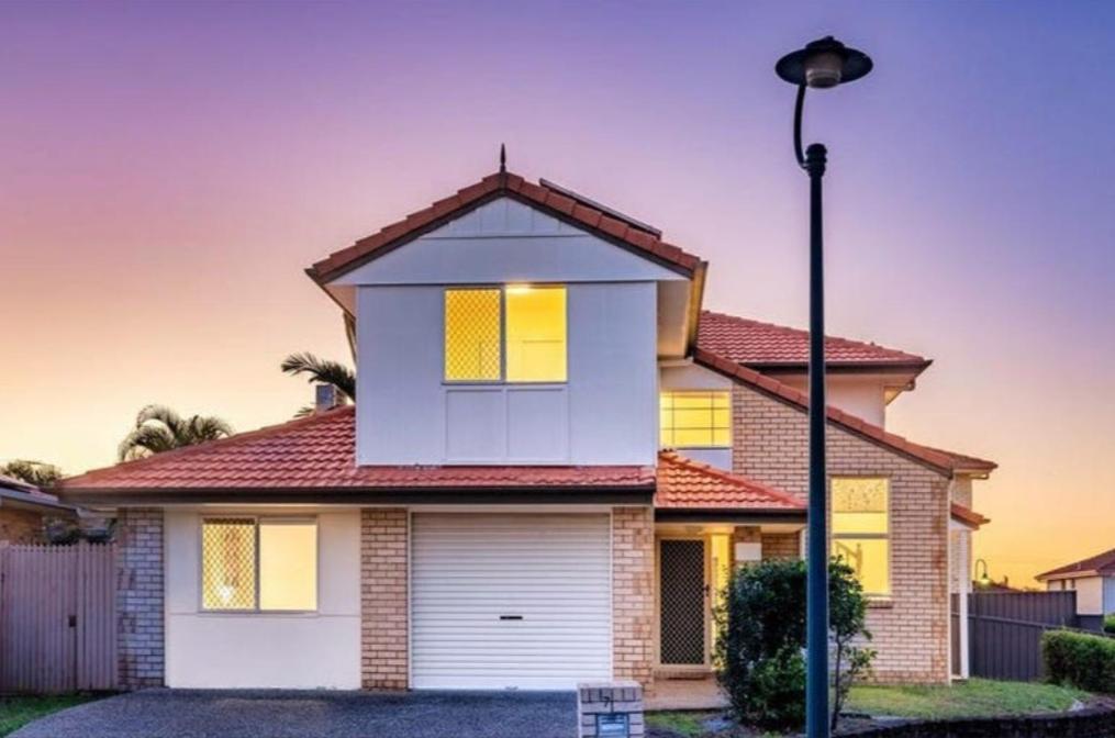 a house with a street light in front of it at Youth Castle in Brisbane