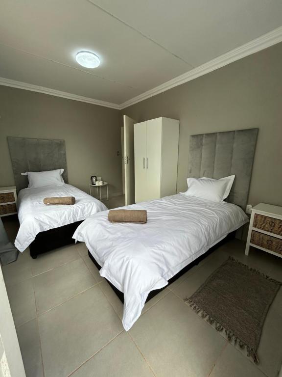 Postel nebo postele na pokoji v ubytování Riverview Pool Resort and Lodge