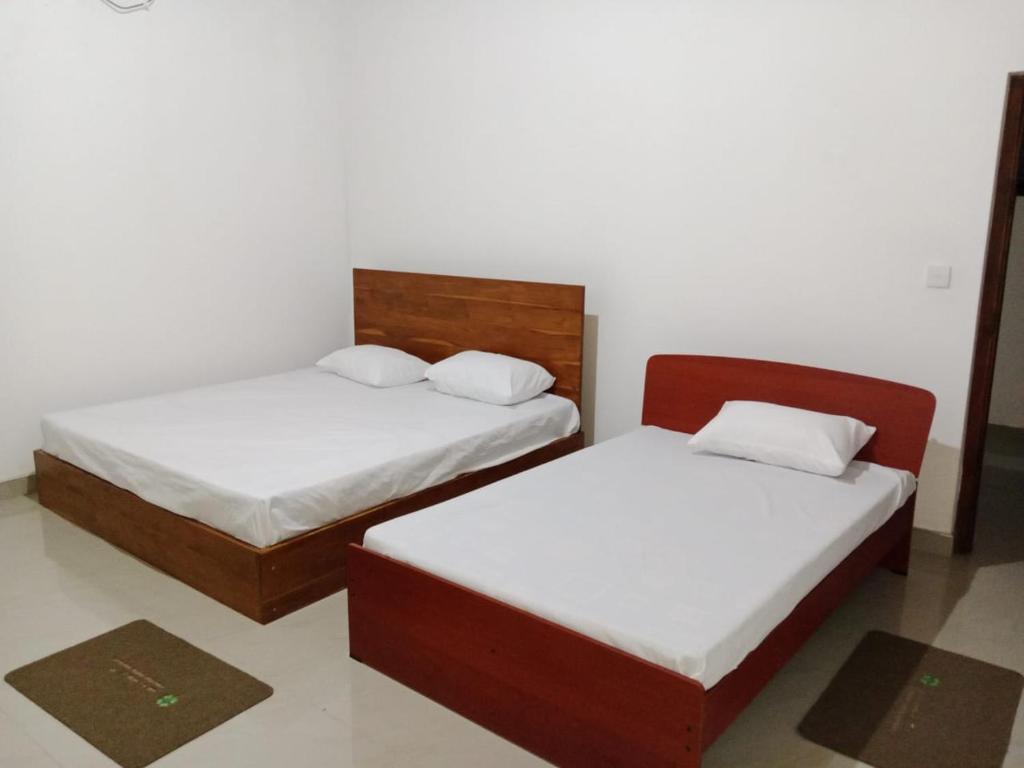 Кровать или кровати в номере Green Heaven Home stay