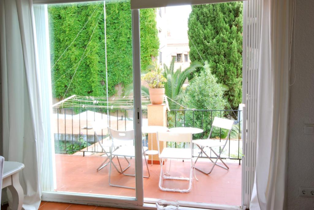 a room with a sliding glass door leading to a balcony at Fraternitat SDB in Barcelona