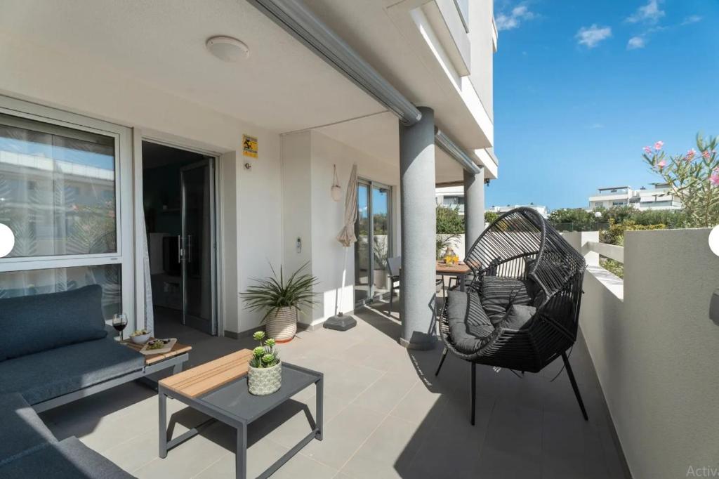 a patio with a couch and a chair and a table at Tejita Beach in La Tejita