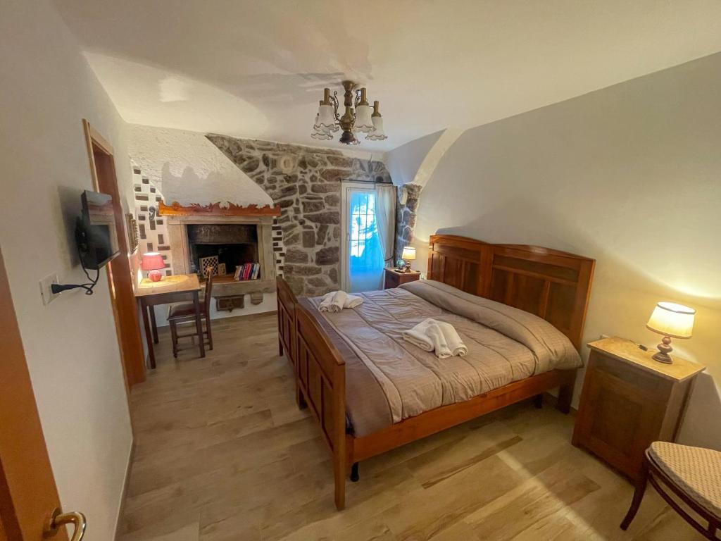 Giường trong phòng chung tại Casa Amadio - stile rustico comfort moderno