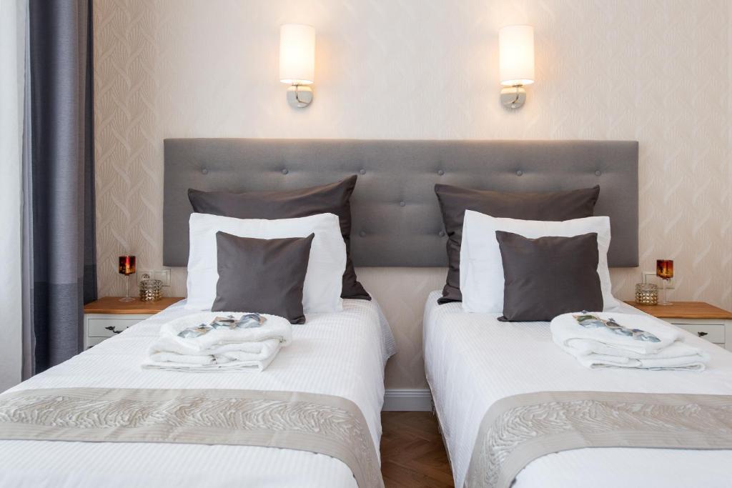 Posteľ alebo postele v izbe v ubytovaní Luxe Living Krakow