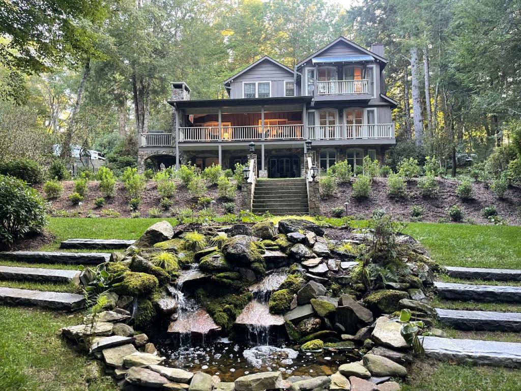 a large house with a pond in front of it at Floralia in Highlands