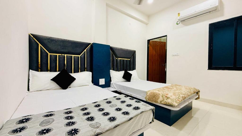 Ένα ή περισσότερα κρεβάτια σε δωμάτιο στο Rukmani Palace