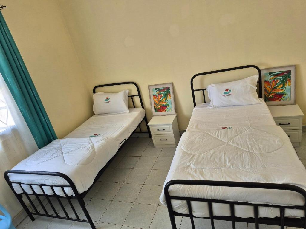 Postel nebo postele na pokoji v ubytování CFC Family Care Home