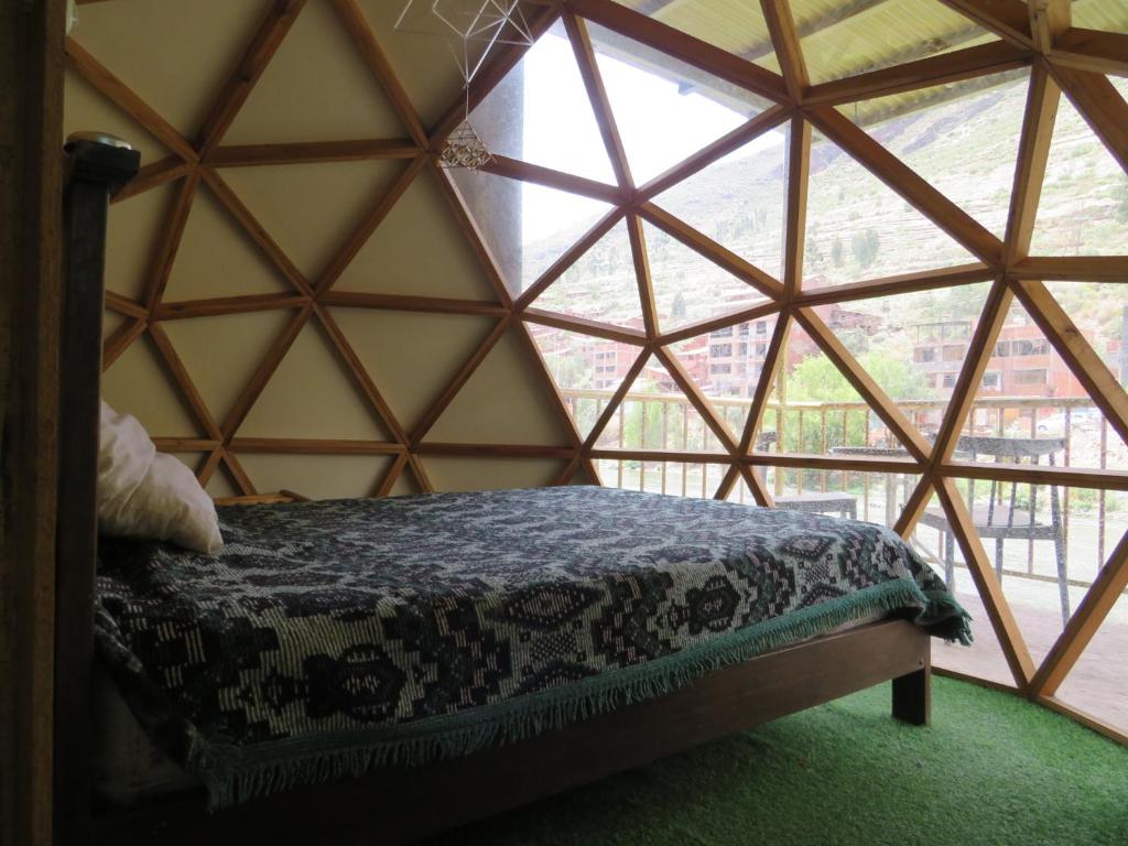 Postel nebo postele na pokoji v ubytování Coca Runa Wasi Hostel