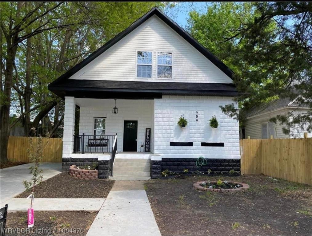 a white house with a black roof at My house your house in Fort Smith