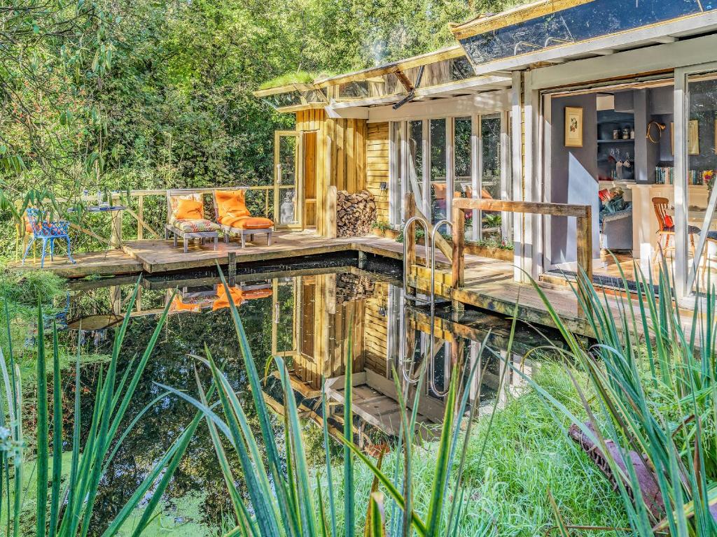 a tiny house in the middle of a pond at The Berm - Uk41199 in Llanfynydd