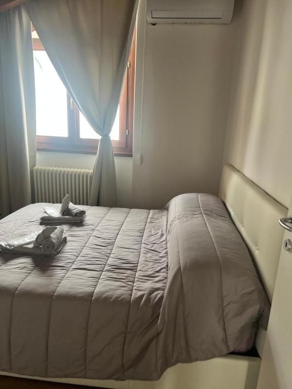 Ένα ή περισσότερα κρεβάτια σε δωμάτιο στο VILLA LIDO - Lake Como