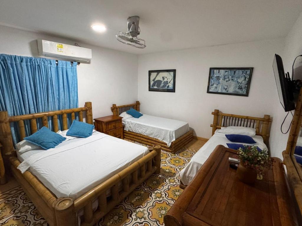 Postel nebo postele na pokoji v ubytování Hotel Casa Confort Cartagena