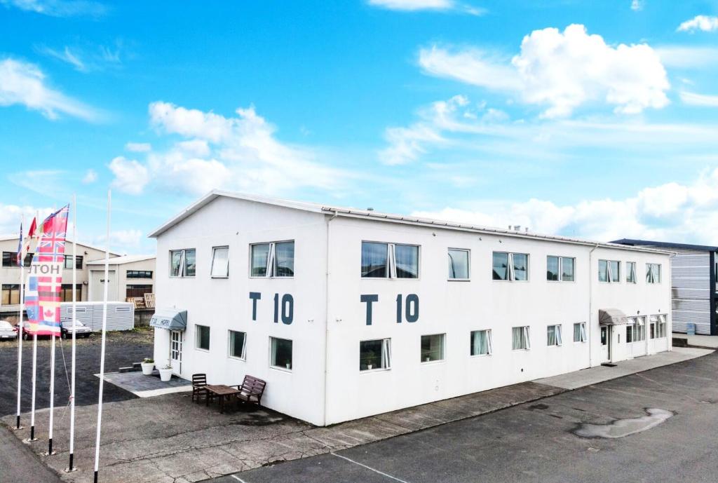 a white building with the number on it at T10 Self check-in Hotel in Hafnarfjördur