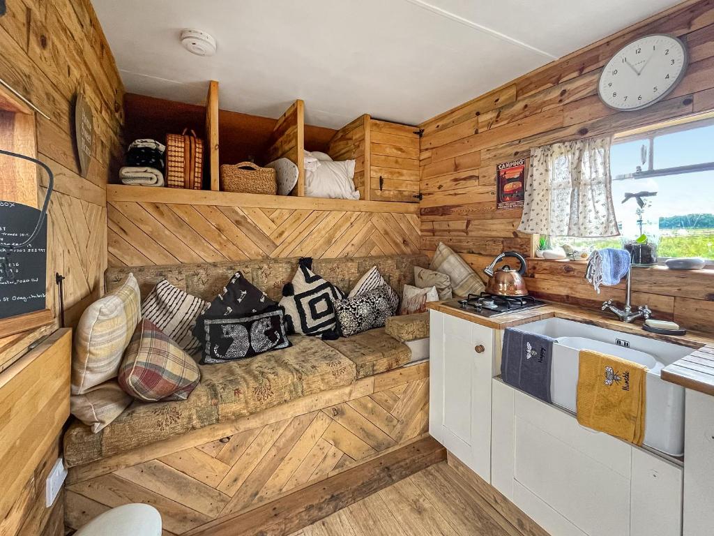 a kitchen with a couch and a sink in a room at The Box - Oasis Farm in Fareham