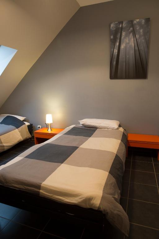 Postel nebo postele na pokoji v ubytování Le Gîte Oratorien